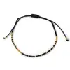 Pulseira Trançada com Miçangas de Arroz Tema Desejos, Feita à Mão com Miçangas Douradas e Miçangas de Arroz, Joia com Design de Costura em Cores Contrastantes Preto e Branco