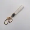 Llavero Nuevo para Coche Cuerda de Llave Exquisita de Alta Gama Llavero con Relieve de Rombo Logo del Coche Colgante con Hebilla de Metal Venta al por Mayor