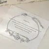 Douyin Transmissão ao Vivo Venda Quente Trevo de Quatro Folhas Joia de Mão Feminina Camélia de Alto Padrão Pulseira de Amor Pulseira Estilo Comutador Atacado