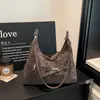 Moderna y versátil nueva colección 2026 de bolsos de axila de nicho para mujer, elegantes bolsos de hombro para mujer, bolsos cruzados de hombro de nicho para mujer