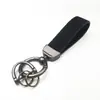 Marca de moda transfronteriza Llavero de coche de gamuza Llavero con logotipo personalizado Colgante de regalo de metal y cuero Al por mayor