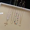 Popular collar multicapa de perlas sol de circón de colores europeo y americano, cadena de clavícula exquisita, gargantilla de diseño de nicho de lujo ligero para mujer
