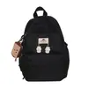 Estilo Ins Japonés Artístico Fresco Color Sólido Mochila Escolar Verano Nuevo Colgante de Galleta Estudiante Mochila de Campus Mujeres