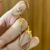Pulsera Popular Antigua de Cruz Negra y Dorada Nueva Lujo Ligero Moda Nicho Joyería Tejida de Gama Alta
