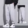 Calça casual masculina primavera calça de moletom plus size solta versátil extra grande tornozelo amarrado Esportiva calça masculina primavera e outono