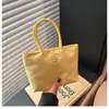 Bolsa de tela nueva transfronteriza color macarrón bolso de mano ligero versátil elegante bolso cubo nicho bolsa de transporte exterior para mujer