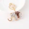 Nueva Cadena de Llave de Aleación Isiya Diamante con Aceite Goteante Elefante Cadena de Llave de Coche Colgante de Bolsa Pequeño Regalo Venta al por Mayor