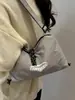 Bolsa Ins Coreana para Estudante Universitário Feminina Nova Tendência 2025 Moda Bolsa Transversal Feminina Nicho Versátil Bolsa de Ombro Feminina