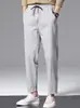 Calça esportiva masculina de verão estilo americano, de seda gelada, secagem rápida, corta-vento, tendência e versátil, com caimento fluido, adequada para uso casual