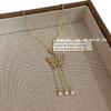 Nuevo collar de borlas de perlas y mariposas huecas de oro de estilo antiguo chino para mujer, exquisito collar de lujo ligero y combinable con todo.