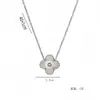 Bestseller transfronterizo collar y pendientes de trébol de cuatro hojas grabados de acero de titanio 18K que no se decoloran, joyería de moda de lujo ligero, venta directa de fábrica