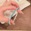 Pulseira Elástica Branca Azul Glacial com Strass Completo e Corda Torcida em Camadas para Mulheres Pulseira de Pulso Temperamento Fashionável de Nicho de Alta Qualidade