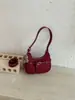 Bolsa de bolinho com design de nicho da moda, nova bolsa de ombro estilosa retrô transfronteiriça em formato de meia-lua, bolsa versátil de ombro e transversal, moderna