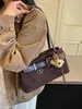 Bolso de hombro retro de diseño de nicho transfronterizo para mujer, nuevo modelo Otoño 2026, bolso de hombro de moda estilo coreano para commuting con textura