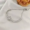 Collar de verano para mujer, sin decoloración, con trébol de cuatro hojas y circonitas, conjunto de tres piezas, collar de acero de titanio, accesorios de alta gama giratorios transfronterizos.
