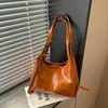 Bolso de mano para mujer 2026 nuevo simple color liso nicho retro versátil diario para ir al trabajo tote bandolera
