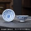 Taza de porcelana azul y blanca estilo japonés directo de fábrica porcelana blanca de Dehua taza de té de tamaño pequeño tazón de té de patas altas taza de paisaje estilo retro