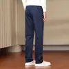 Pantalones casuales para hombre de fibra de bambú, color liso, resistentes a las arrugas, colección otoño 2026 nueva, pierna recta, corte ajustado, elásticos, versátiles, largos, venta al por mayor