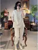 Nuevo Traje de Lino Estilo Nacional Chino Verano Botón de Rana Manga Corta Holgado Top con Abertura Pantalones Casuales de Nueve Puntos Conjunto de Dos Piezas
