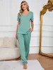Toma real en stock Estilo europeo y americano de Amazon pijamas cómodos ropa de casa para mujer traje casual de manga corta con pantalones y escote de color liso