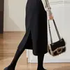 Otoño e invierno Nueva falda negra de cintura alta con abertura Falda de lana línea A falda simple para mujer para ir al trabajo