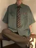 Camisa Rayada Retro Americana Versátil para Hombre, de Manga Corta, Estilo Primavera y Otoño, Chaqueta Holgada de Marca de Tendencia para Pareja