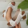 Sandalias de Tacón Alto Huecas con Flor Versátil de Temperamento 2026 Verano Nueva Moda Casual Talla Grande Sandalias con Correa de Hebilla de Tacón Grueso