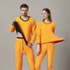 Nuevo traje de ropa interior térmica de terciopelo dorado 2023 con forro polar engrosado a prueba de frío para pareja ropa de otoño pantalones largos