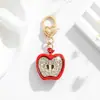 Producto Nuevo de Venta Caliente Transfronterizo Europeo y Americano en Amazon Colgante Creativo de Manzana Hongo Llavero Accesorio