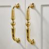 Manija de puerta de gabinete viento crema francés de lujo ligero dorado brillante moderno simple de alta gama minimalista italiano manija de cajón de gabinete