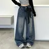 Calça Jeans Estampa Graffiti para Meninas Primavera/Outono 2026 Novo Estilo Calça Wide Leg Super Estilosa Infantil Calça Longa Versátil para Alunos do Ensino Fundamental