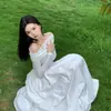 Vestido de Tricô Branco Off-Shoulder com Drapê Estilo Francês para Mulheres, Vestido Longo de Manga Longa Linha A, Novo Estilo Pura Desejo Outono 2026