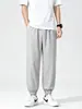 Fábrica de comercio exterior selecciona cuidadosamente pantalones jogger de seda helada, pantalones deportivos casuales de verano finos de secado rápido, pantalones de nueve puntos holgados para hombre