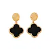 Pendientes de botón de trébol de cuatro hojas dorados martillados de lujo ligero francés de alta venta transfronteriza, adornos para orejas negros y verdes, pendientes versátiles para el commute para mujer