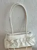 Bolso de axila de moda de nicho para mujer de gran capacidad, nuevo modelo de principios de otoño de 2026, alto valor estético, bolso cuadrado pequeño de un solo hombro de color sólido