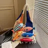 Bolsa de Tricô Patchwork Versátil Estilo Retro de Nicho Transfronteiriça com Franjas Nova Coleção Primavera 2026 Bolsa de Ombro Color-Blocking Bolsa Tote