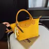 Bolso de mano diario transfronterizo modelo 2026 para mujer, bolso nicho de cuero vintage tipo albóndiga, bolso de hombro y cruzado para el trabajo