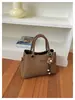 Bolso de mano ins de alta gama y elegante, bolso de hombro y cruzado, nuevo estilo vintage 2026, bolso tipo cubo popular para mujer para el día a día