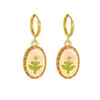 Aretes colgantes florales de estilo pastoral transfronterizos europeos y americanos, estampado ovalado de gota de aceite, joyería vintage, versátiles para otoño e invierno