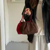 Bolso de diseño nicho coreano principios de otoño 2026 bolso cubo color sólido vintage bolso de mano para el día a día bolso bandolera para el trabajo