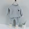 Ropa infantil de comercio exterior primavera y otoño traje infantil niños cuello redondo color sólido suéter de dibujos animados niños casual estilo coreano traje de dos piezas