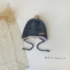 Gorro de Bebé Lindo con Bola de Pelo Estilo Coreano Otoño e Invierno Estilo Nuevo Protección para Orejas Cálido Cortavientos con Cordones Gorro de Lana para Niños y Niñas