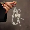 Estilo Ins Cadena de Lanyard con Lazo de Perlas Cadena para Teléfono Móvil Llavero Colgante para Bolsa de Cámara Accesorios Mayoreo