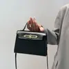 Bolso de Color Sólido para Mujer 2026 Nuevo Modelo Bolso Cruzado de PU Diseño de Nicho Bolso de Mano de Lujo de Gama Alta Bolso Cuadrado Pequeño