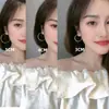 Novedad 2025 Pendientes de Moda con Baño de Oro Real de 18K con Acabado de Alta Gama, Pulidos a Espejo, Pendientes de Aro Grandes Únicos con Flor de Cáñamo