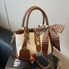 Bolsas pequenas populares de cross-border para mulheres deste ano, novas bolsas versáteis de ombro da moda para o verão de 2026, bolsas estilo balde coreanas