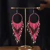 Joyas populares europeas y americanas fuente transfronteriza estilo étnico bohemio retro pendientes largos de borla de cuentas de arroz para mujer