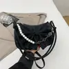 2025 Nuevo Bolso Pequeño Suave para Mujer Bolso Cruzado con Lazo Bolso de Hombro Versátil con Cadena Empalmada de Perlas