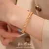 Pulsera de doble capa circular hueca con cierre chapado en oro real de 18 quilates con circonitas, accesorio de mano exquisito y moderno, joyería de nicho de lujo ligero