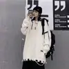 Suéter de calle de alto diseño tejido rasgado agujeros cosidos estilo perezoso para hombre otoño e invierno suéter de hip-hop americano cuello redondo